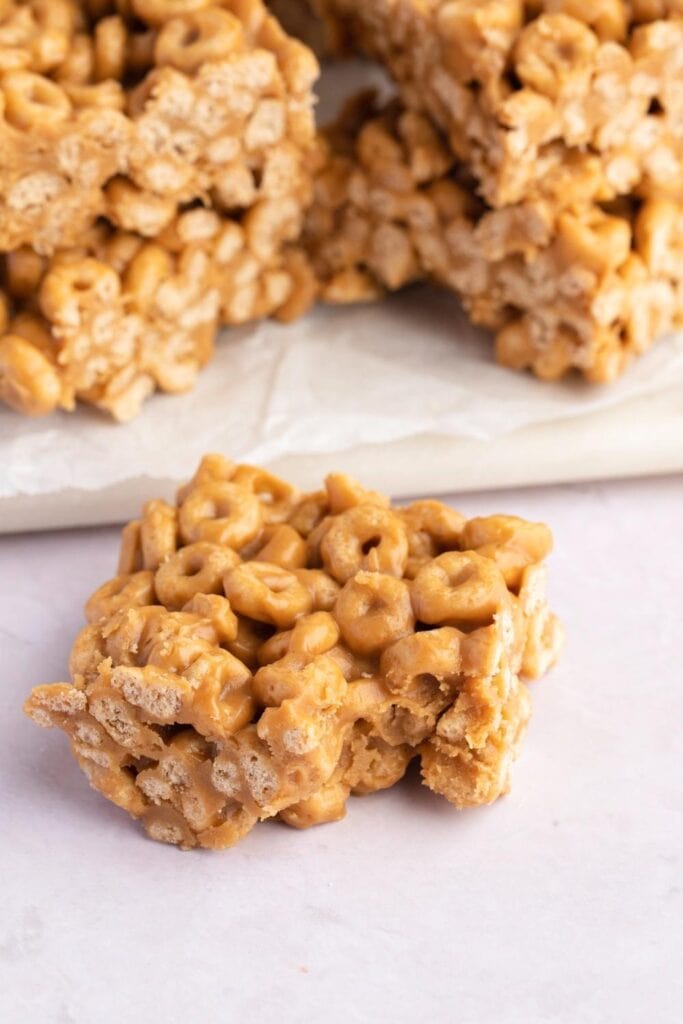 Peanut Butter Cheerio Bars with a bite taken out of the corner