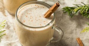 Puerto Rican Coquito Eggnog with Cinnamon in a Glass