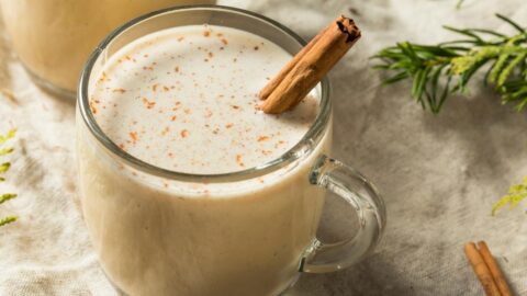 Puerto Rican Coquito Eggnog with Cinnamon in a Glass