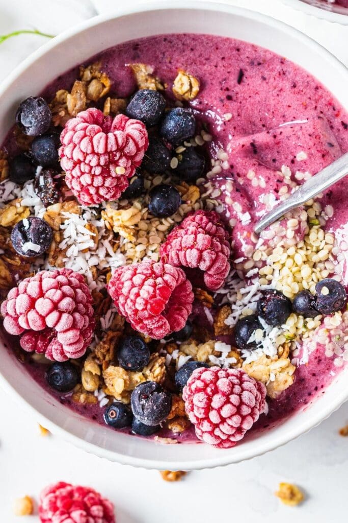 Raspberry Smoothie Bowl with Fresh Berries, Nuts and Oats