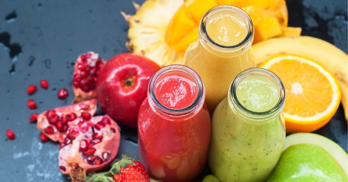 Refreshing Fruit Smoothies with Apple, Orange, Strawberries and Pomegranate