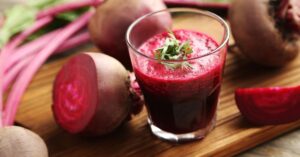 Refreshing Homemade Beet Juice in a Wooden Board