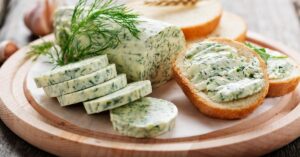 Slices of Homemade Herb Butter with Bread