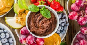 Sweet Hummus Dip with Strawberries, Apple, Grapes and Crackers