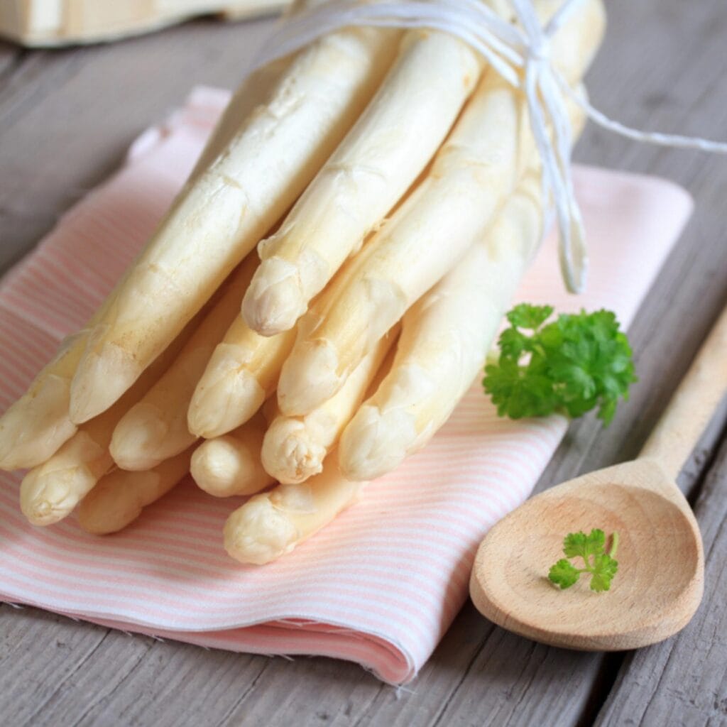 Handful of fresh white asparagus