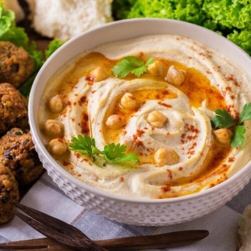 https://insanelygoodrecipes.com/wp-content/uploads/2022/10/Appetizing-Chickepea-Hummus-in-a-White-Bowl-500x500.jpg