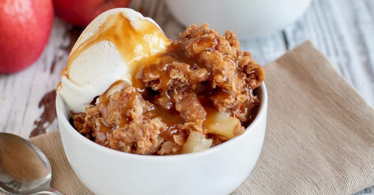 Bowl of Homemade Apple Crisp with Ice Cream and Caramel Sauce