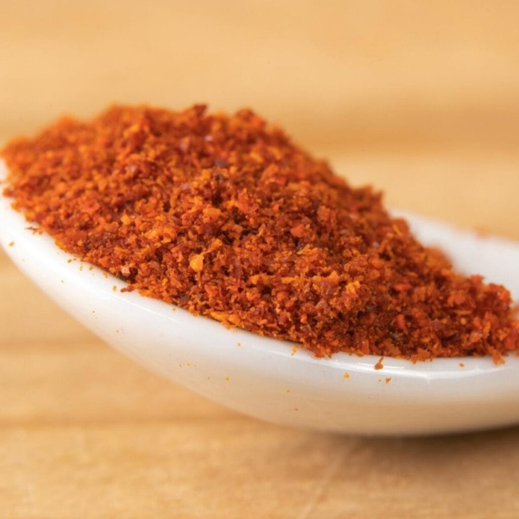 Cayenne Pepper on a White Plastic Spoon