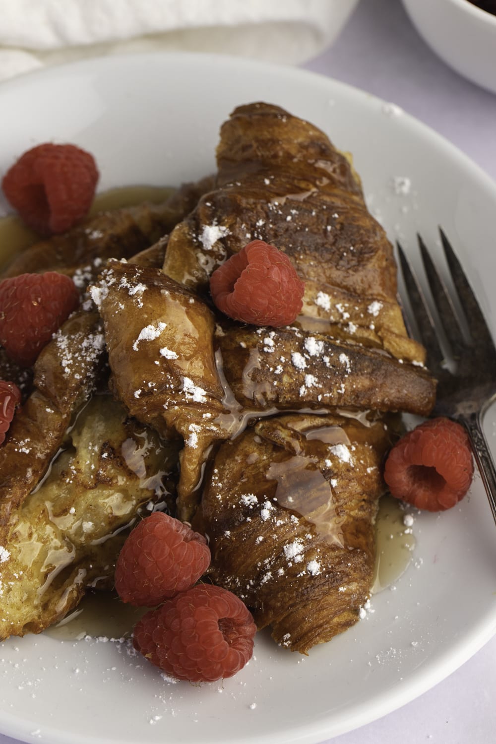 Delicious Croissant French Toast with Raspberries and Honey