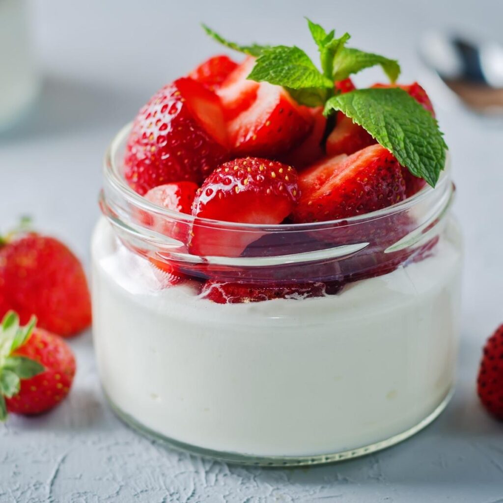 Greek Yogurt with Fresh Strawberries in a Glass Container