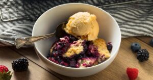 Homemade Berry Cobbler with Ice Cream In A Bowl
