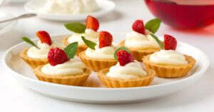 Homemade Strawberry Tarts with Whipped Cream and Fresh Fruits