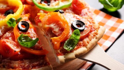 Homemade Vegetarian Pizza with Tomatoes, Olives and Basil