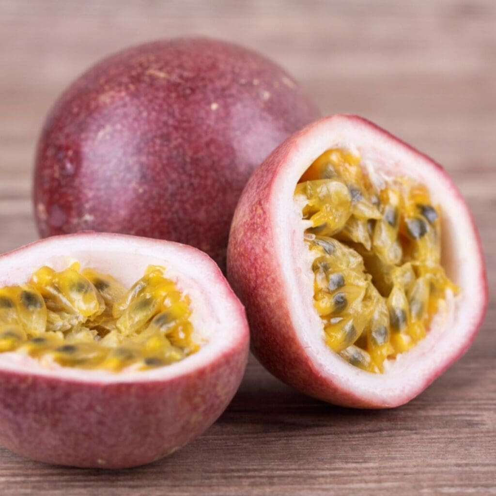 Whole and Cut Into Half Fresh Passion Fruit