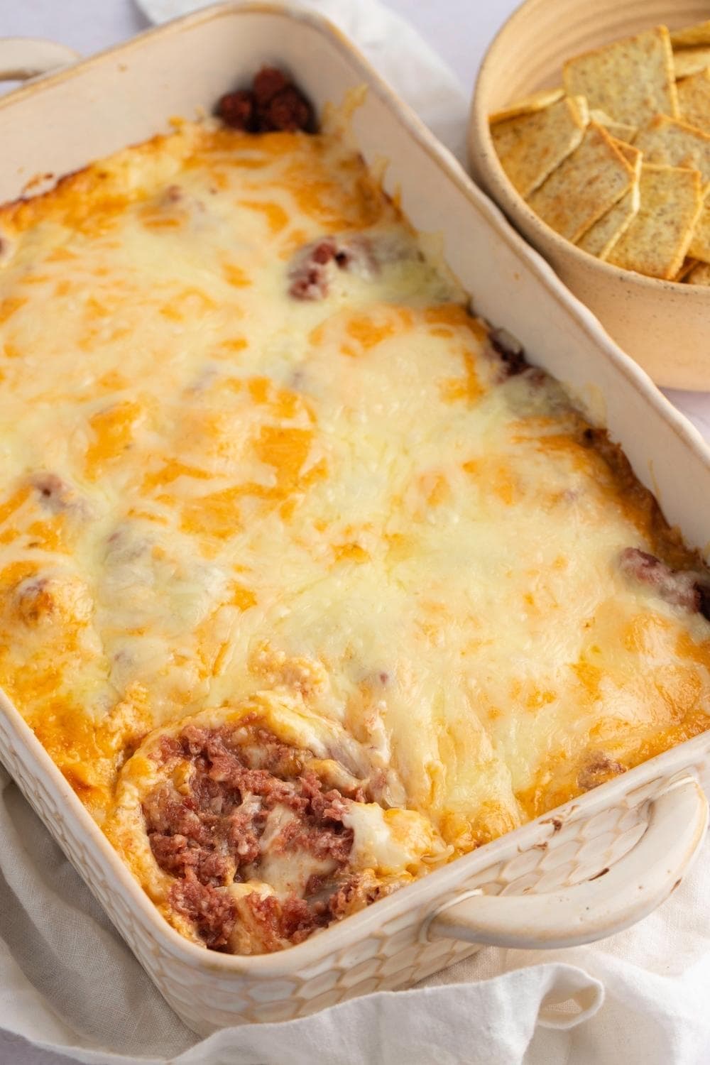 Mix of corned beef, sauerkraut, mayo dressing and lots of melted cheese on top served on a casserole
