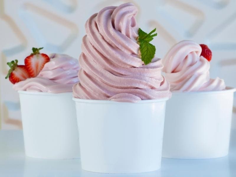 Strawberry Softserve on Small Cups Topped With Fresh Strawberries