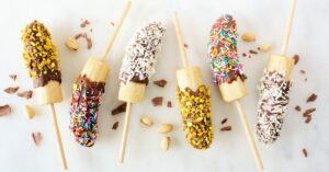 Sweet Chocolate Covered Banana Pops with Candies, Nuts and Coconut