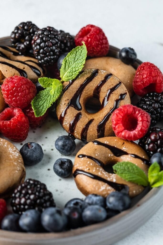 Sweet Homemade Cinnamon and Chocolate Mini Donuts with Berries