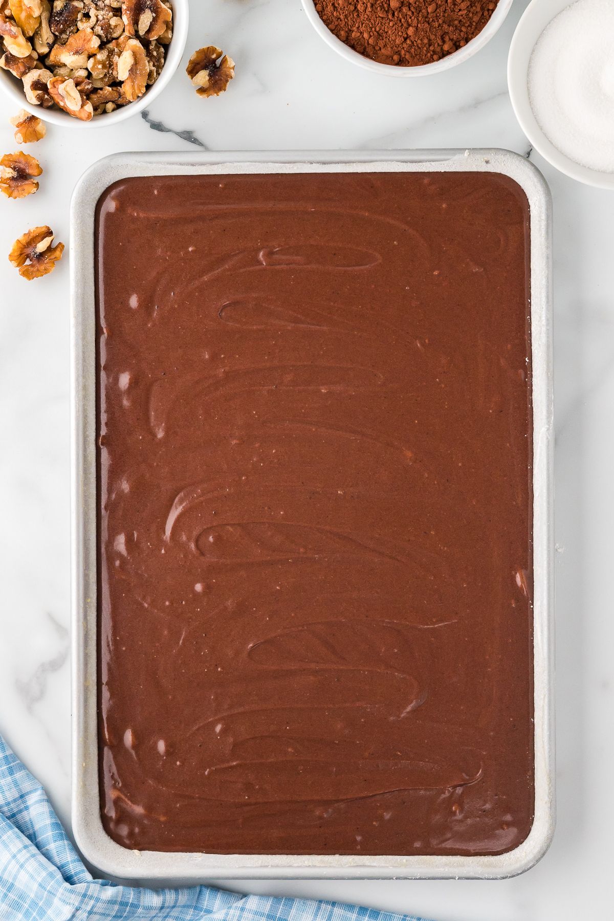 Cake batter in a sheet pan.