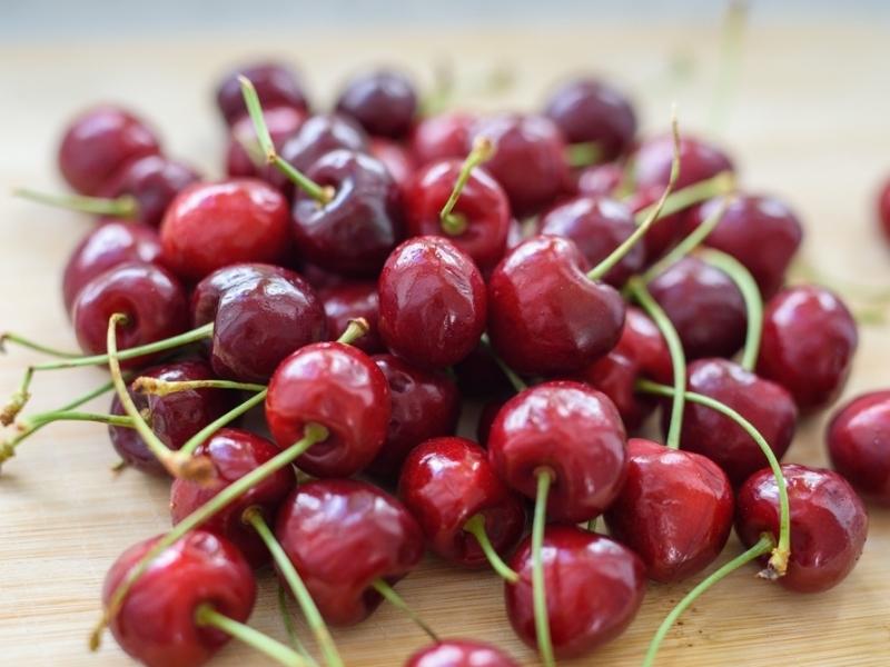 Tulare Cherries on a Wooden Table