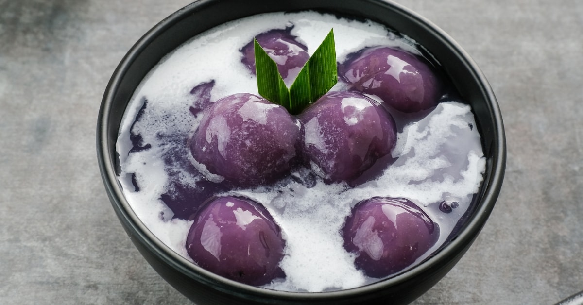 Bowl of Homemade Porridge with Purple Sweet Potatoes and Coconut Milk