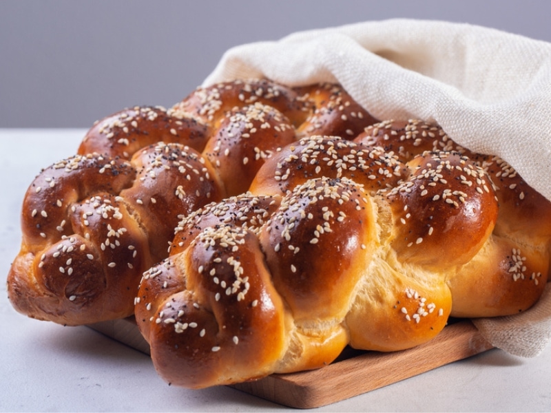 Freshly Baked Challah Bread Wrapped in White Cloth
