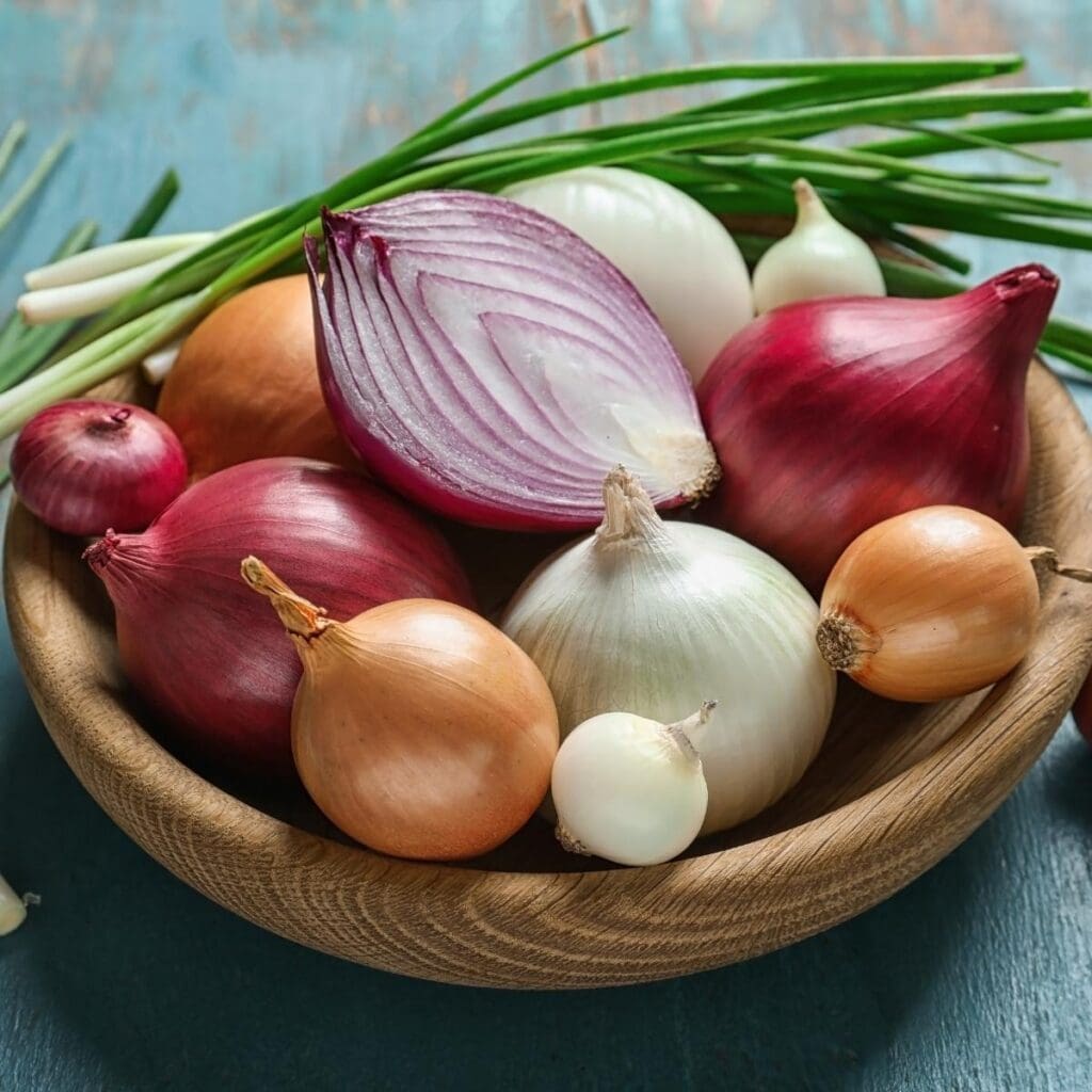 Different Types of Colorful Onions in a Wooden Bowl