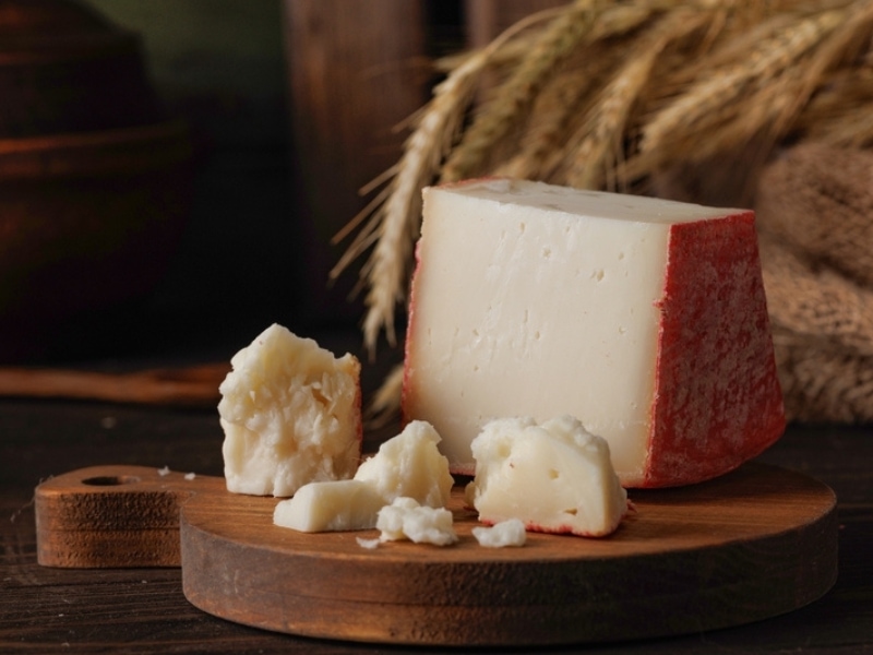 Fontina Cheese on a Wooden Chopping Board