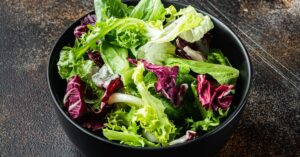 Fresh Organic Various Types of Lettuce in a Black Bowl