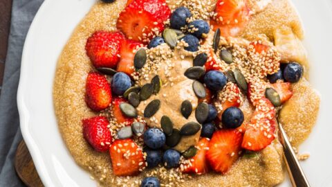 Healthy Homemade Amaranth Porridge with Berries, Peanut Butter and Pumpkin Seeds