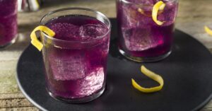 Homemade Boozy Purple Haze Cocktail with Lemon and Empress Gin