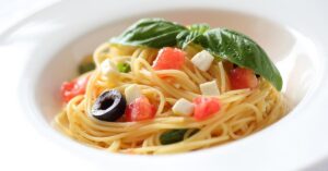 Homemade Capellini Pasta with Olives, Tomatoes and Basil
