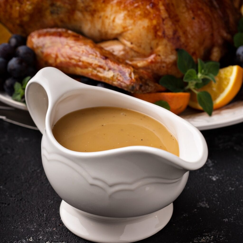 Homemade Gravy in a White Boat Shaped Bowl