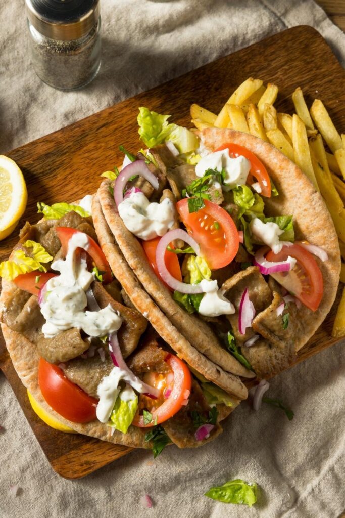 Homemade Greek Gyros Sandwich with Tomatoes, Lettuce and Fries