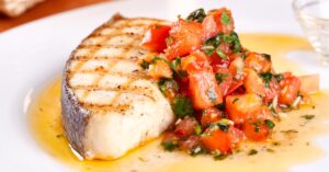 Homemade Grilled Corvina Fish with Tomatoes and Herbs