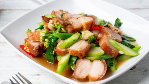 Homemade Grilled Pork Belly with Stir-Fried Vegetables in a White Plate