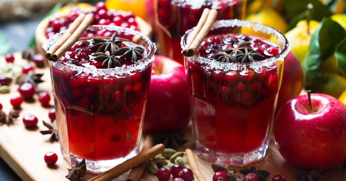 Homemade Hot Punch Cranberry Cocktails with Cinnamon and Fruits