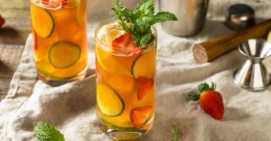 Homemade Summer Punch with Cucumber and Strawberries in a Glass