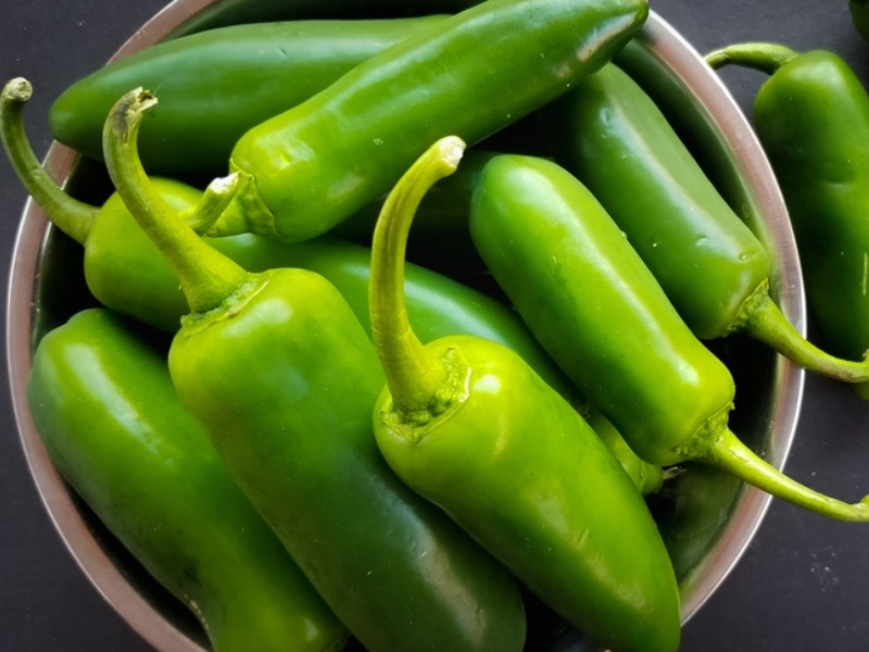 Fresh Jalapeño Peppers on a Wooden Bowl
