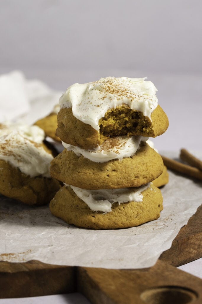 Stack of Pumpkin Cookies with Cream Cheese Frosting