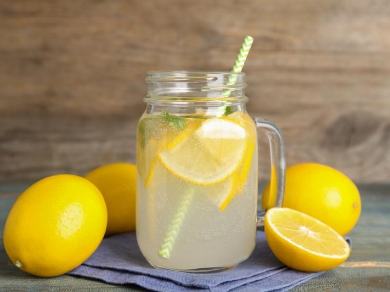 Lemonade Lemons and a Glass of Refreshing Lemonade