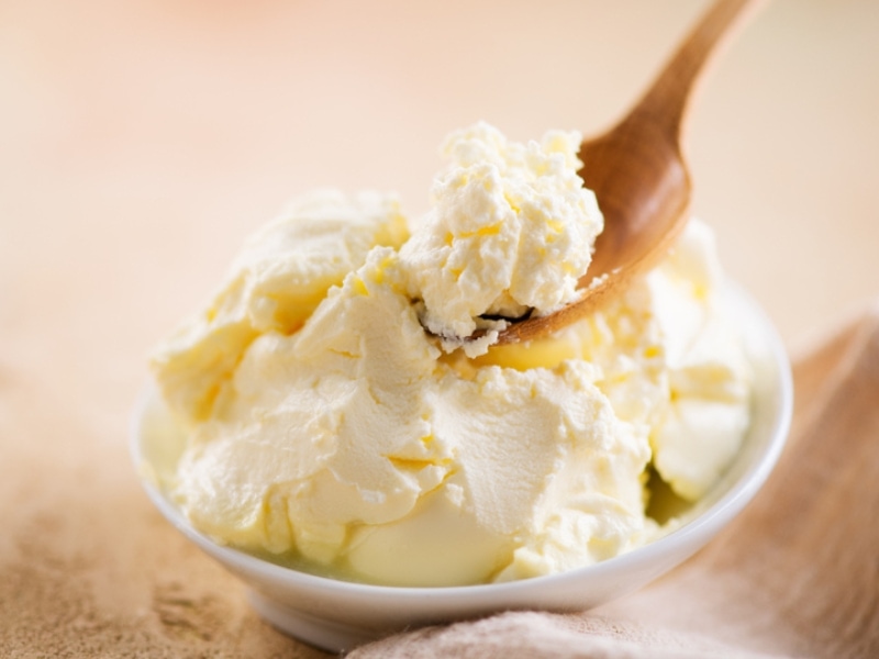 Creamy Mascarpone Cheese Scooped by a Wooden Spoon 