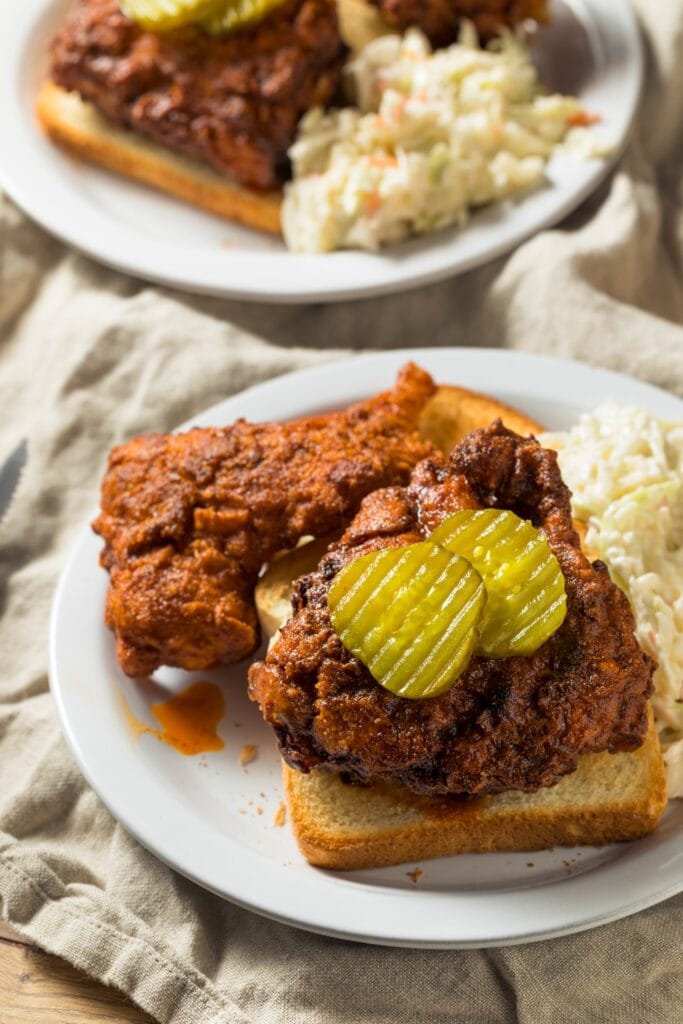 Nashville Hot Chicken Served with Pickles, Coleslaw and Bread