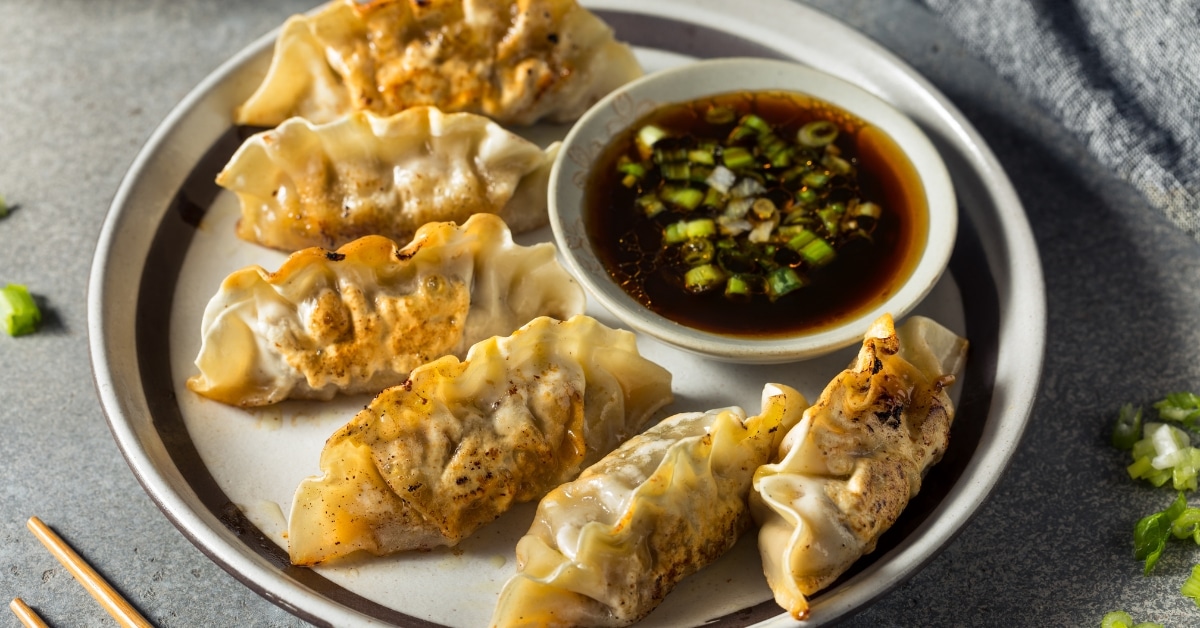 Pot Stickers with Sauce and Onions