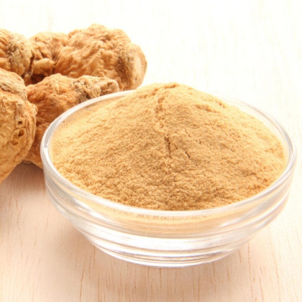 Maca root and maca powder in a small glass dish