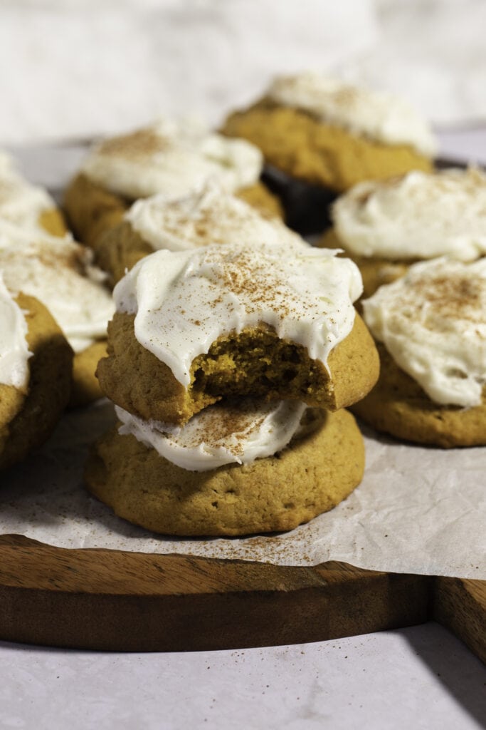 Pumpkin Cookies with Cream Cheese Frosting and Sprinkled Cinnamon Powder