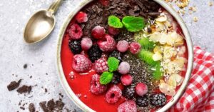 Raspberry Smoothie Bowl with Chia Seeds, Chocolate, Kiwi and Almonds