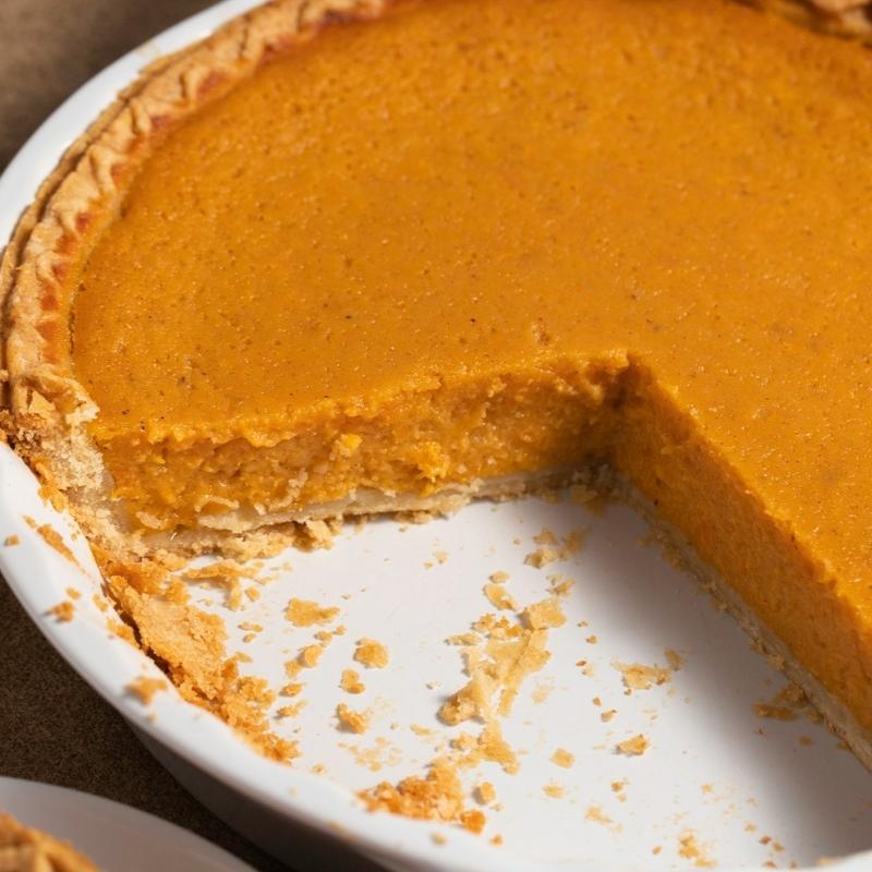 Sweet Potato Pie in Baking Pan with a wedge cut out
