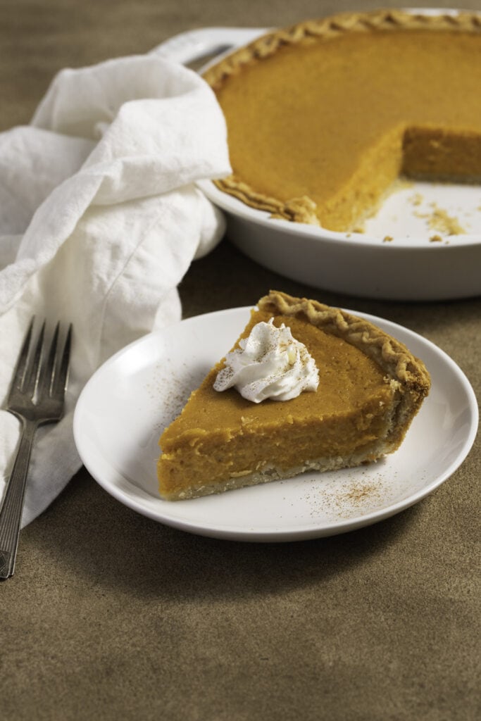 Sweet Potato Pie Slice With Whipped Cream on Top 