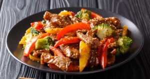 Teriyaki Beef with Broccoli, Sesame Seeds, Yellow and Red Bell Peppers